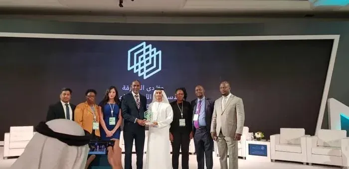 Award presentation on stage at the Sharjah FDI Forum