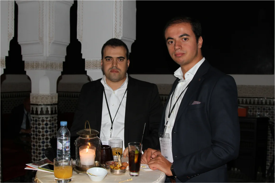 Participants networking in the courtyards of La Mamounia during the evening reception