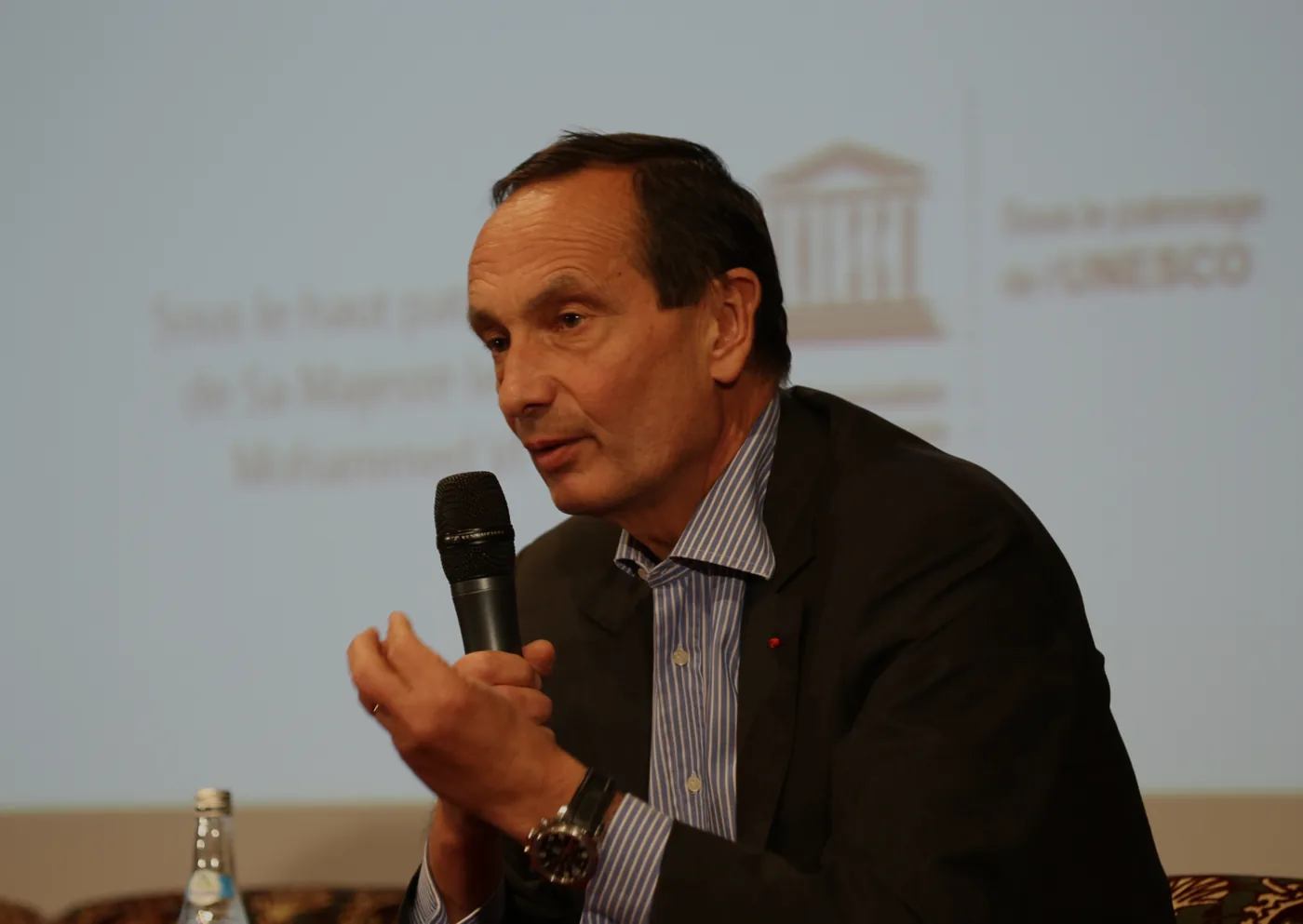 A speaker addressing the forum at La Mamounia